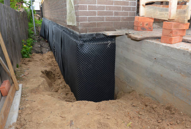 Happy homeowners after waterproofing job in Bennington